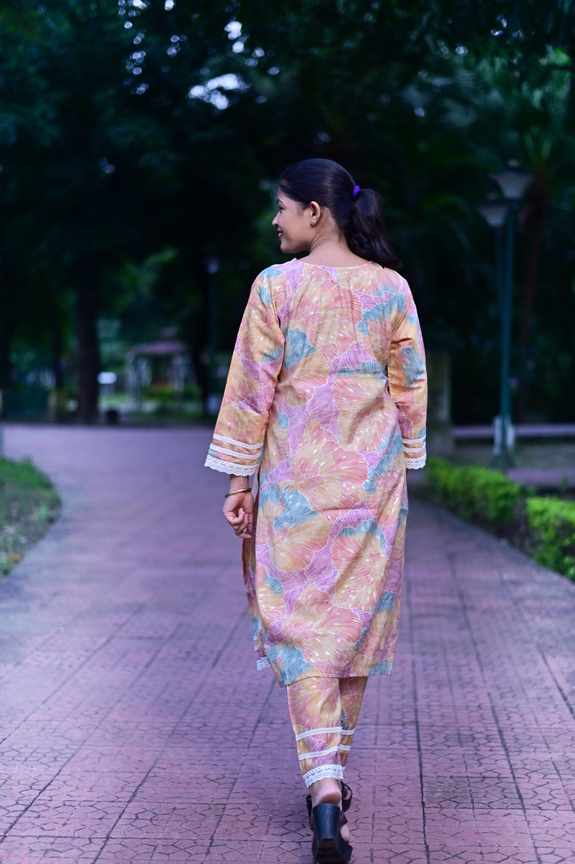 Back view of Pastel Blossom printed Roman Silk floral kurta pant set with lace detailing