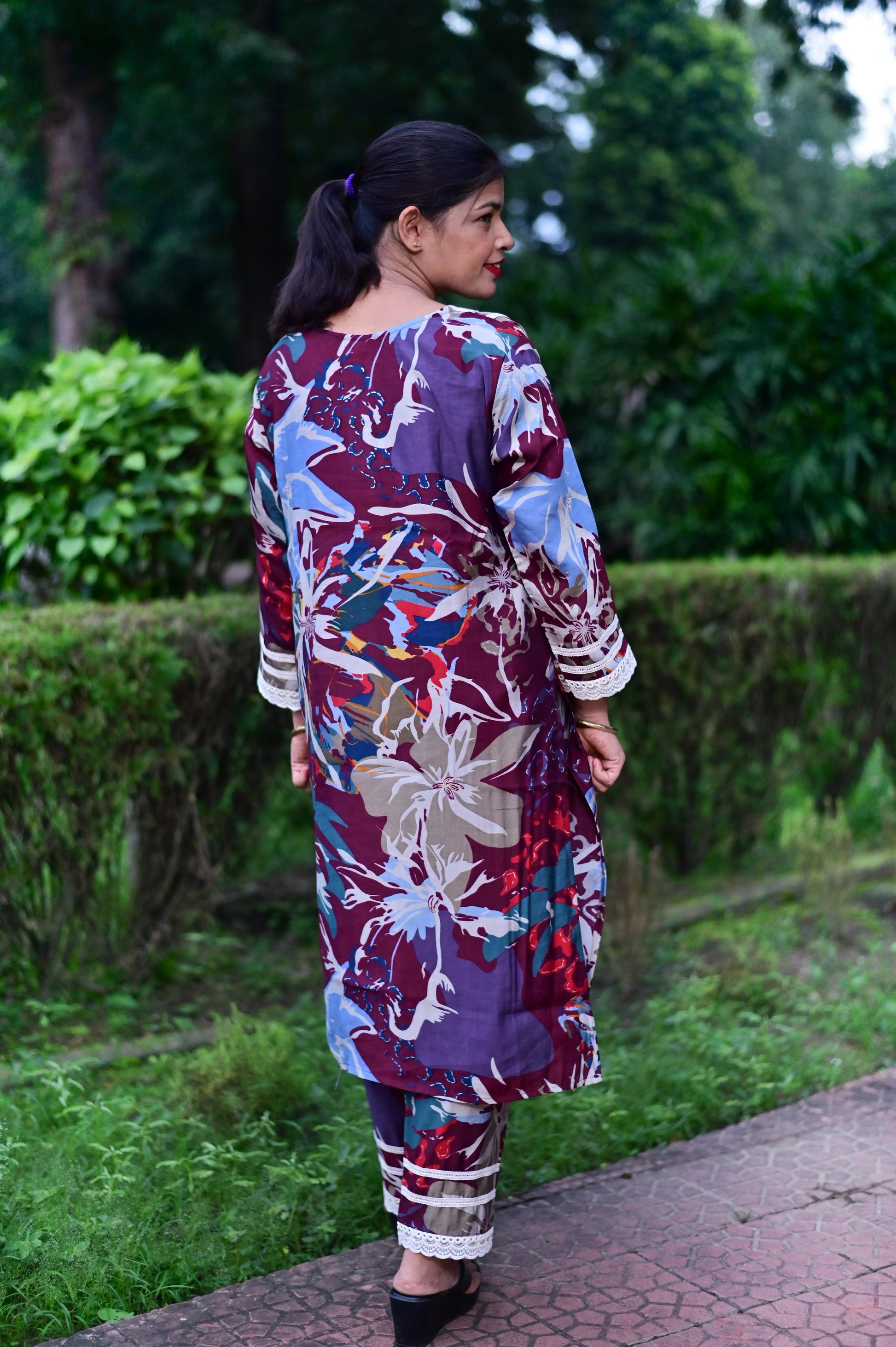 Back view of Vibrant floral fantasy Roman Silk kurta set for festive occasions