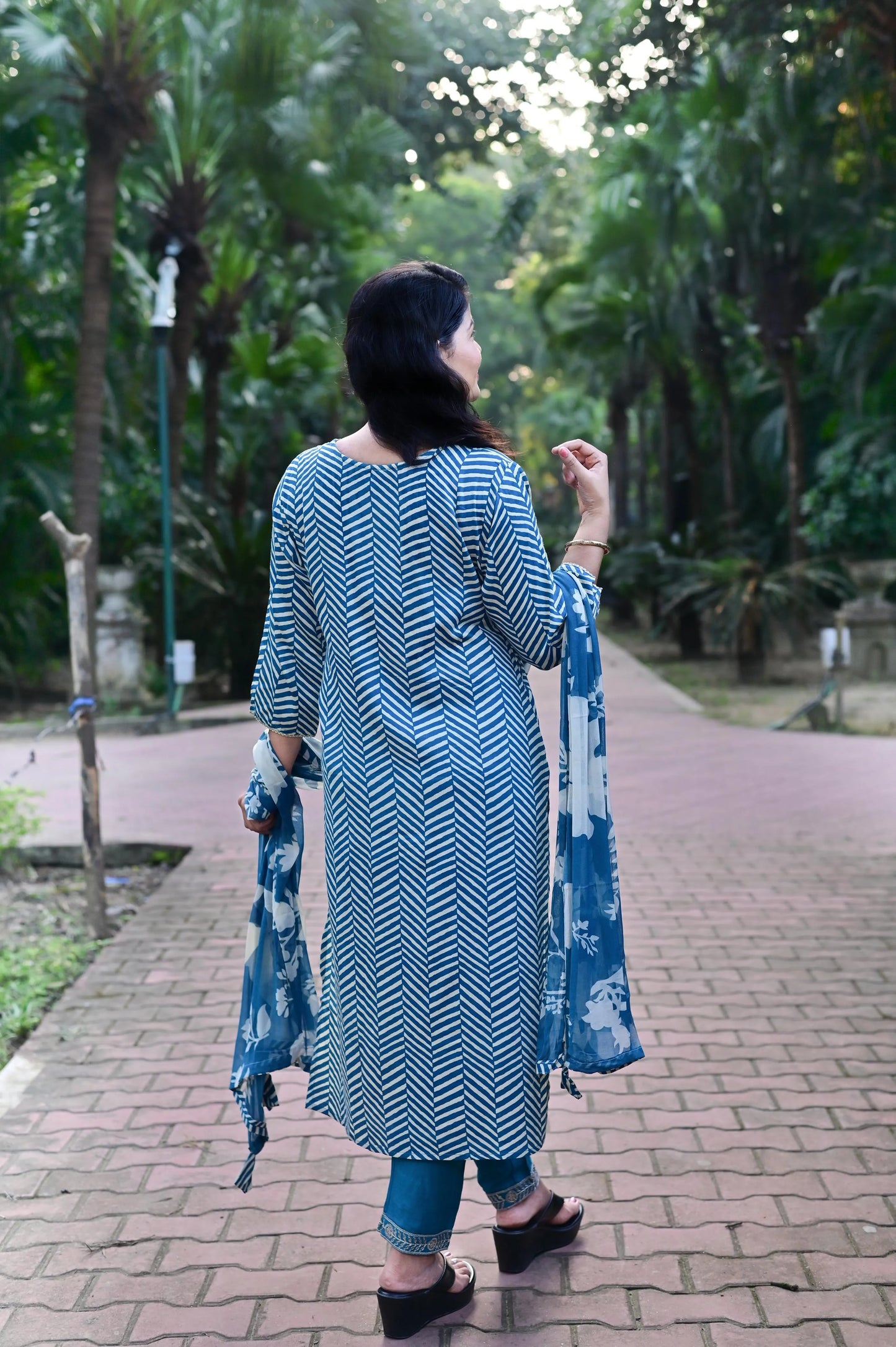 Back view of blue chevron print kurta with floral dupatta