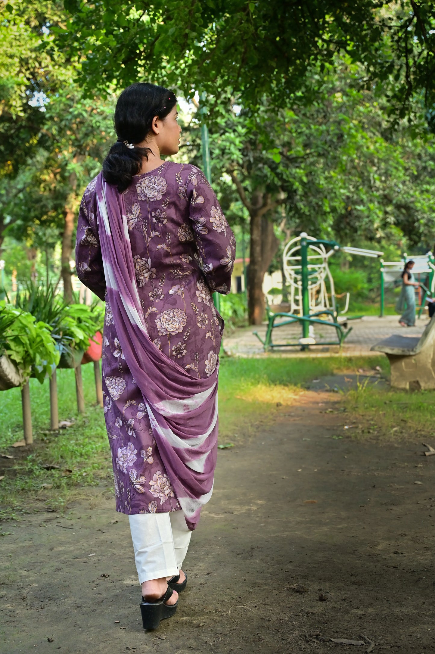 Back view of plum purple kurta with floral print and embroidered detailing