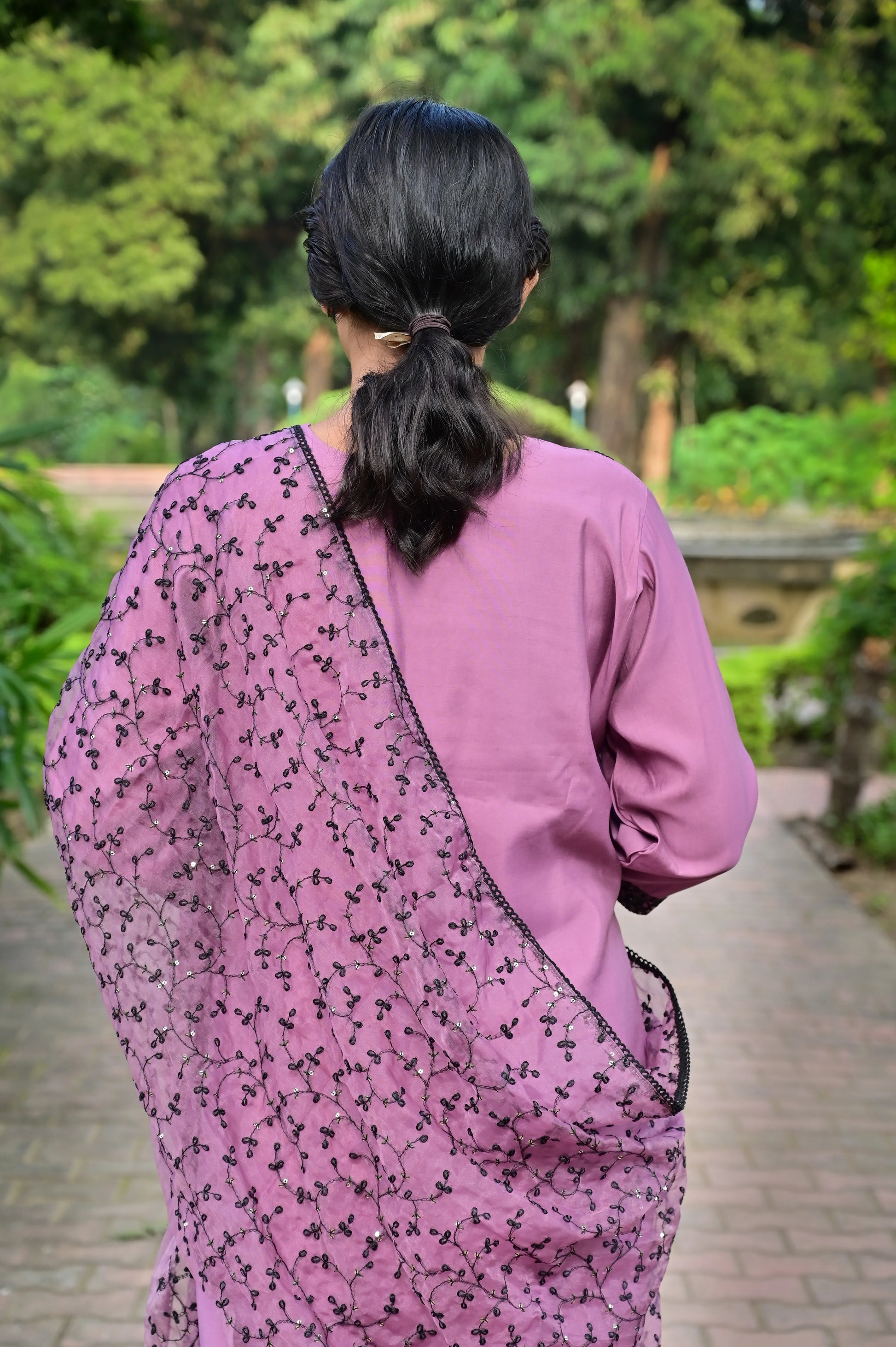 Close-up of black floral embroidery on lavender silk kurta