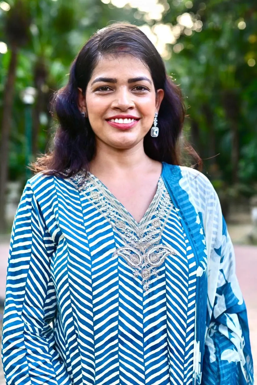 Close-up of embroidered neckline on blue satin kurta