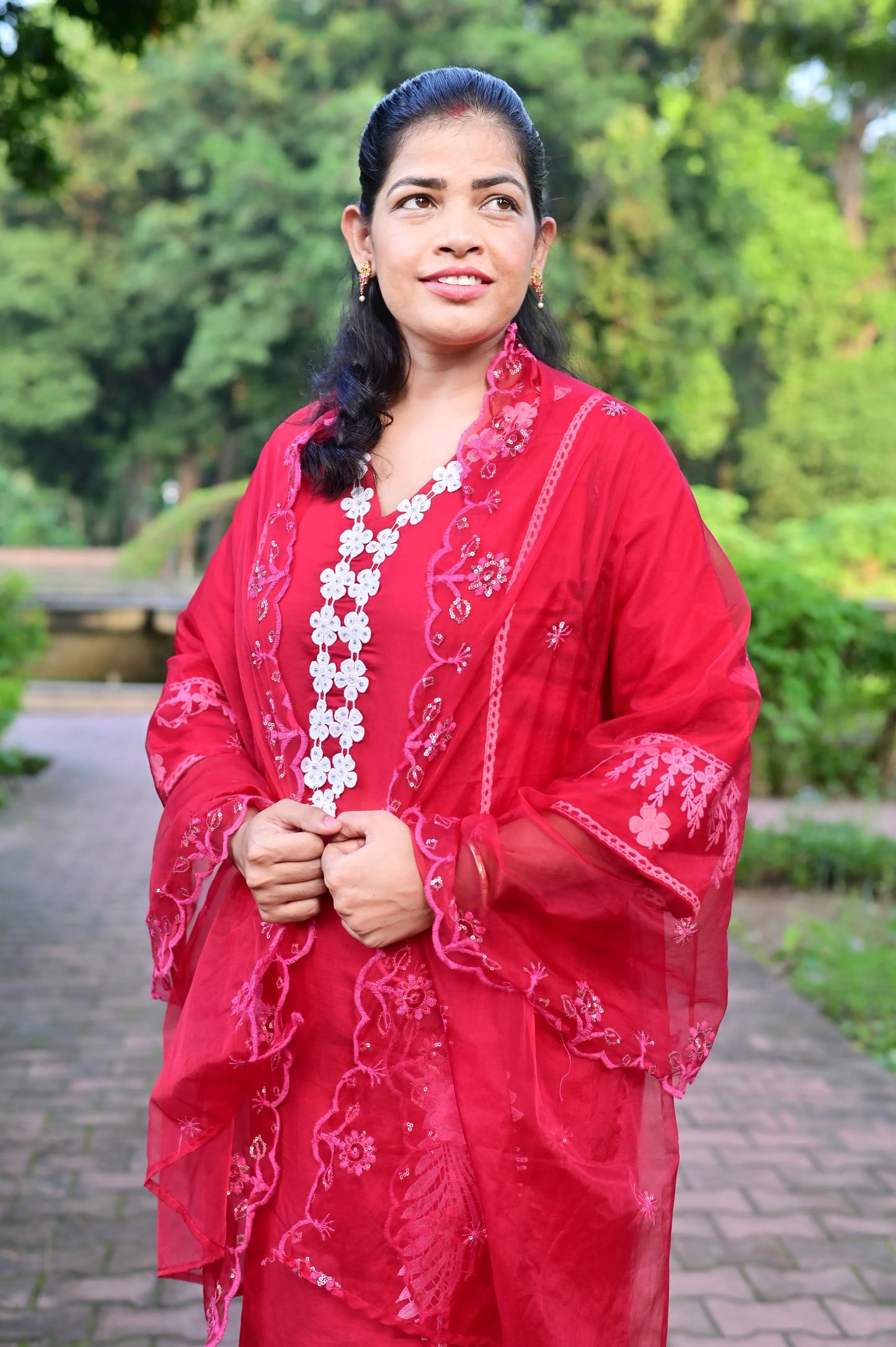 Elegant red cotton blend kurta pant set with white embroidery and net dupatta close-up