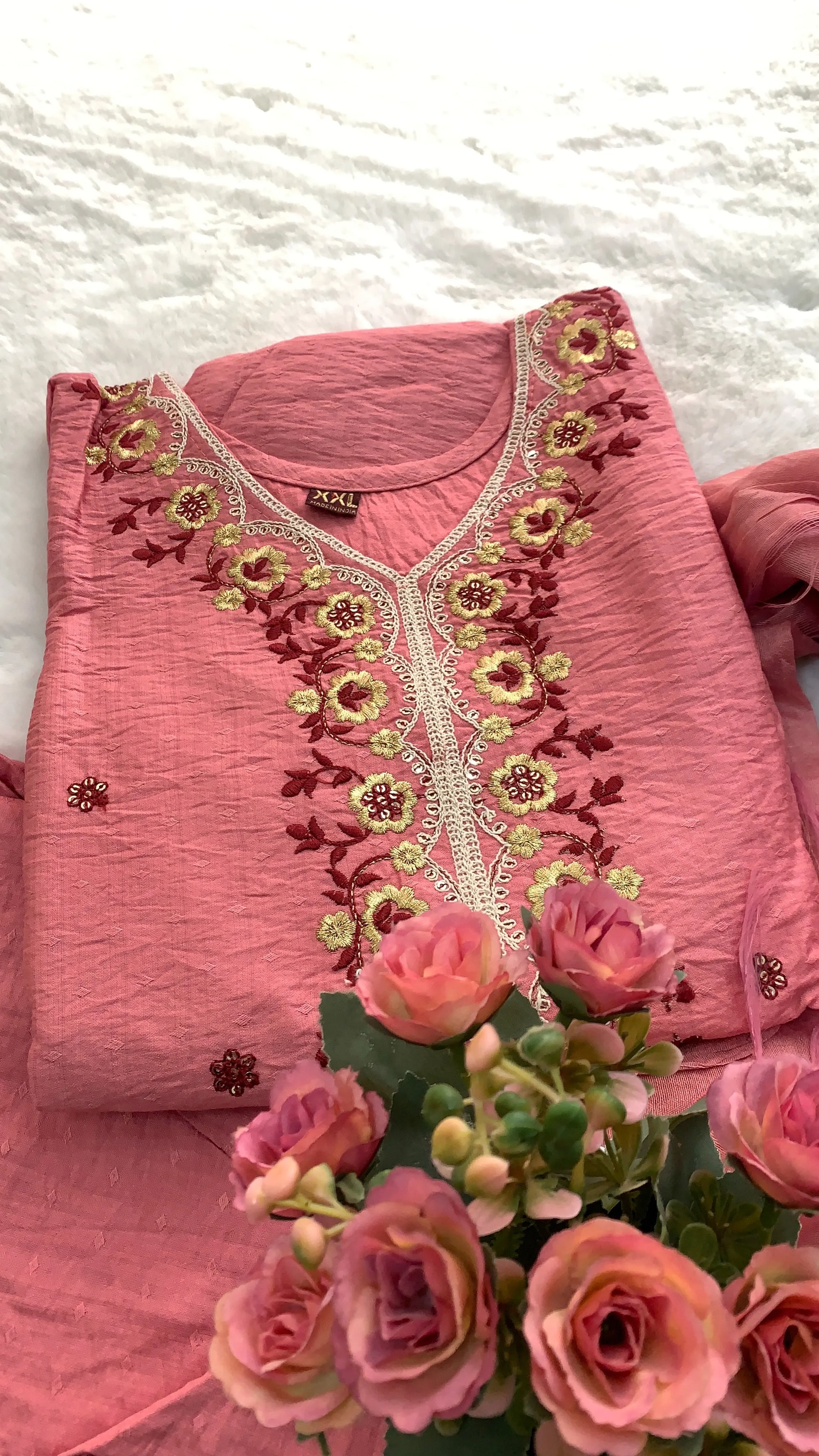 Close up of Rose pink muslin Anarkali kurta set for festive occasions