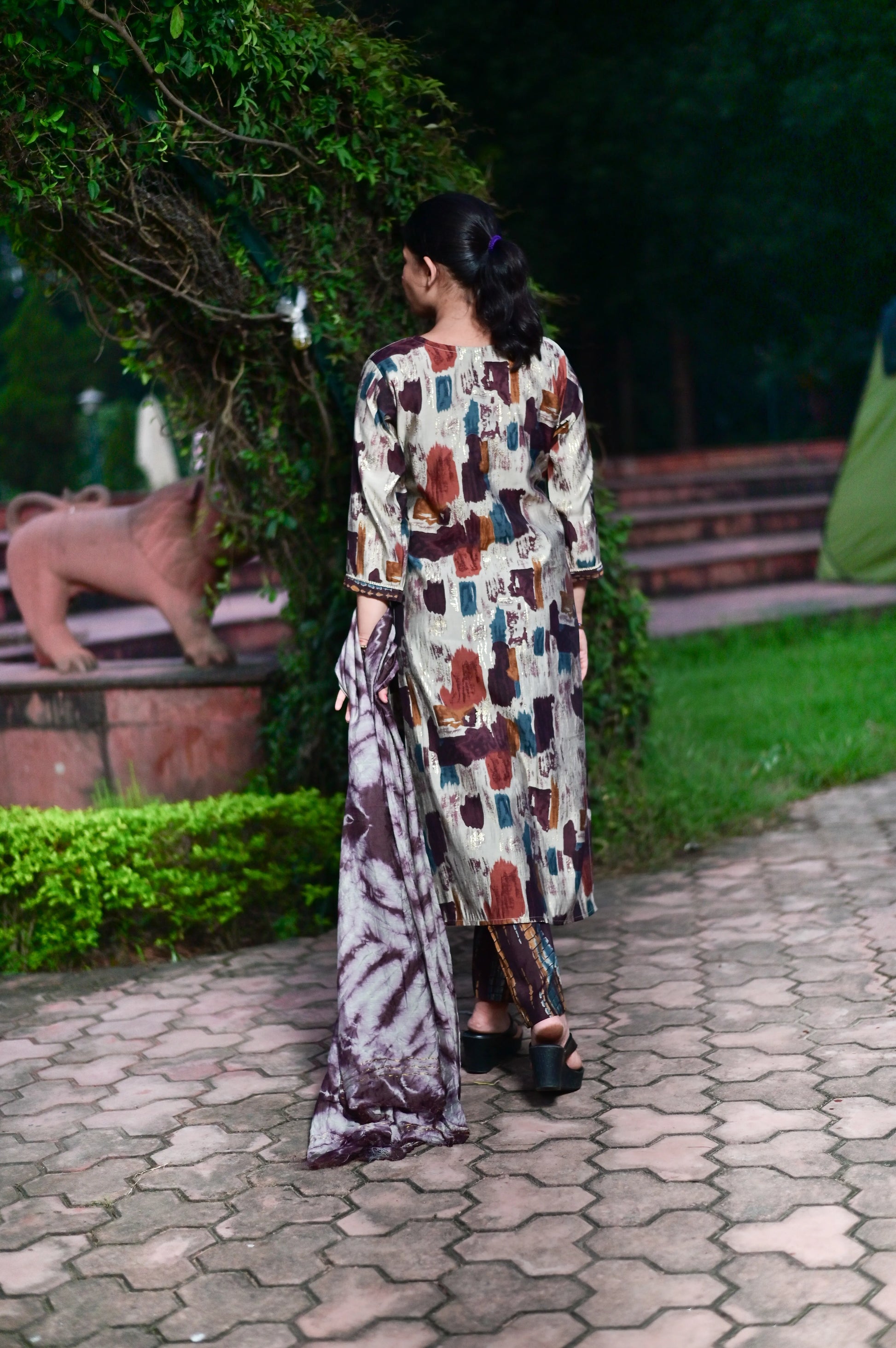 Elegant brown kurta pant set styled with tie-dye dupatta back