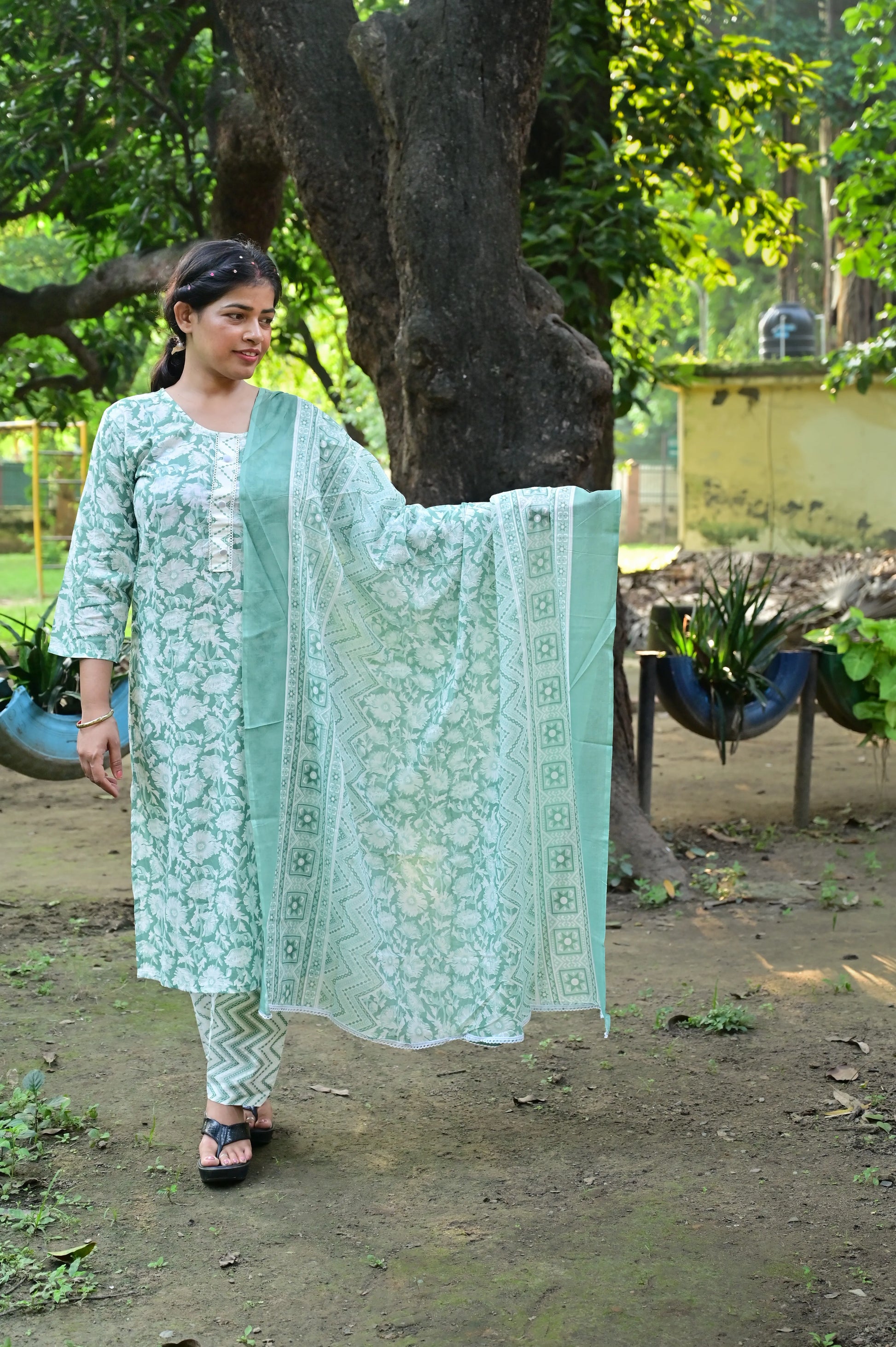 Pastel mint green and dusty rose floral cotton kurta pant set with matching dupatta.