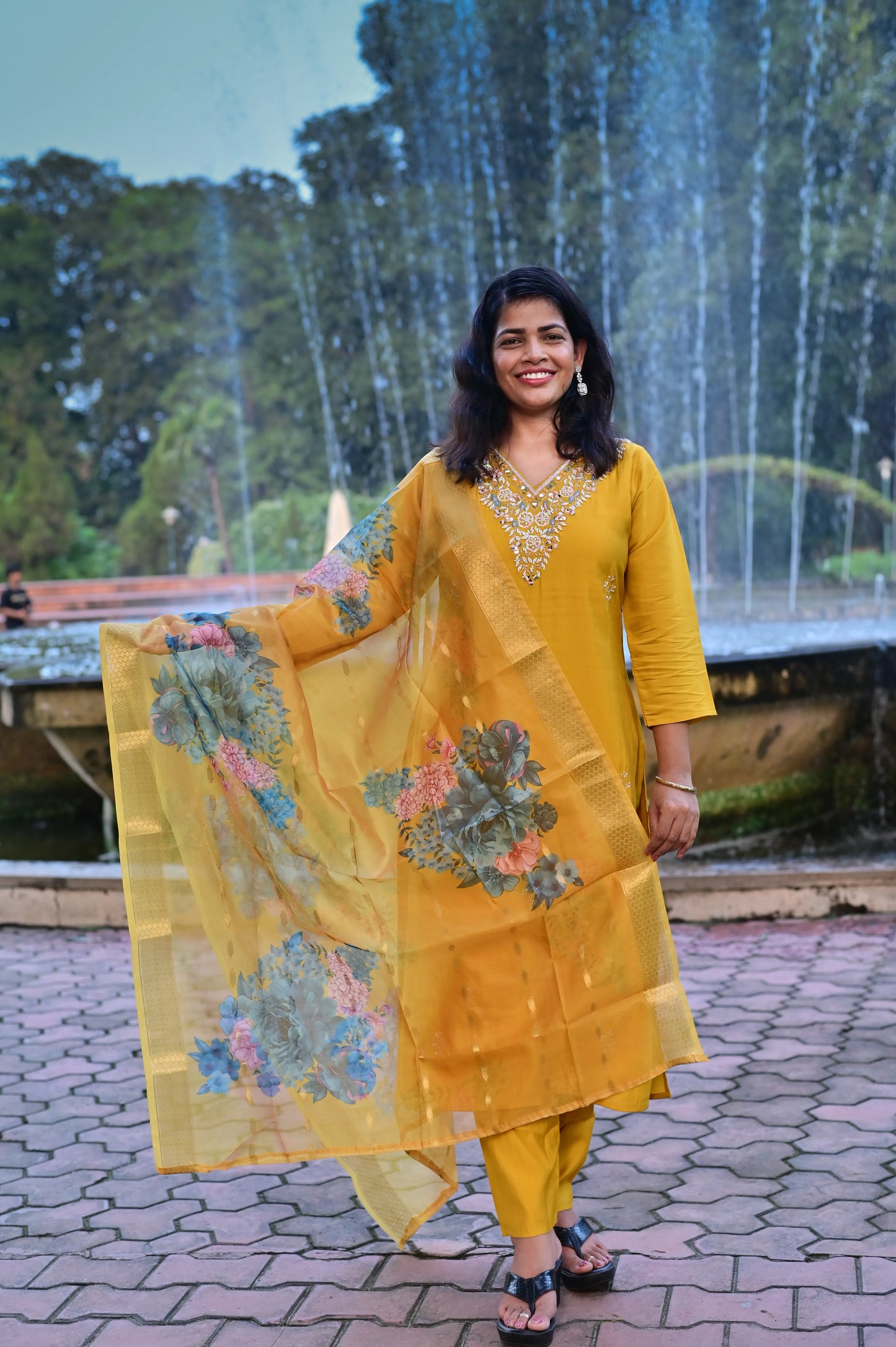 Sunshine yellow muslin 3-piece suit with intricate embroidery and floral organza dupatta front