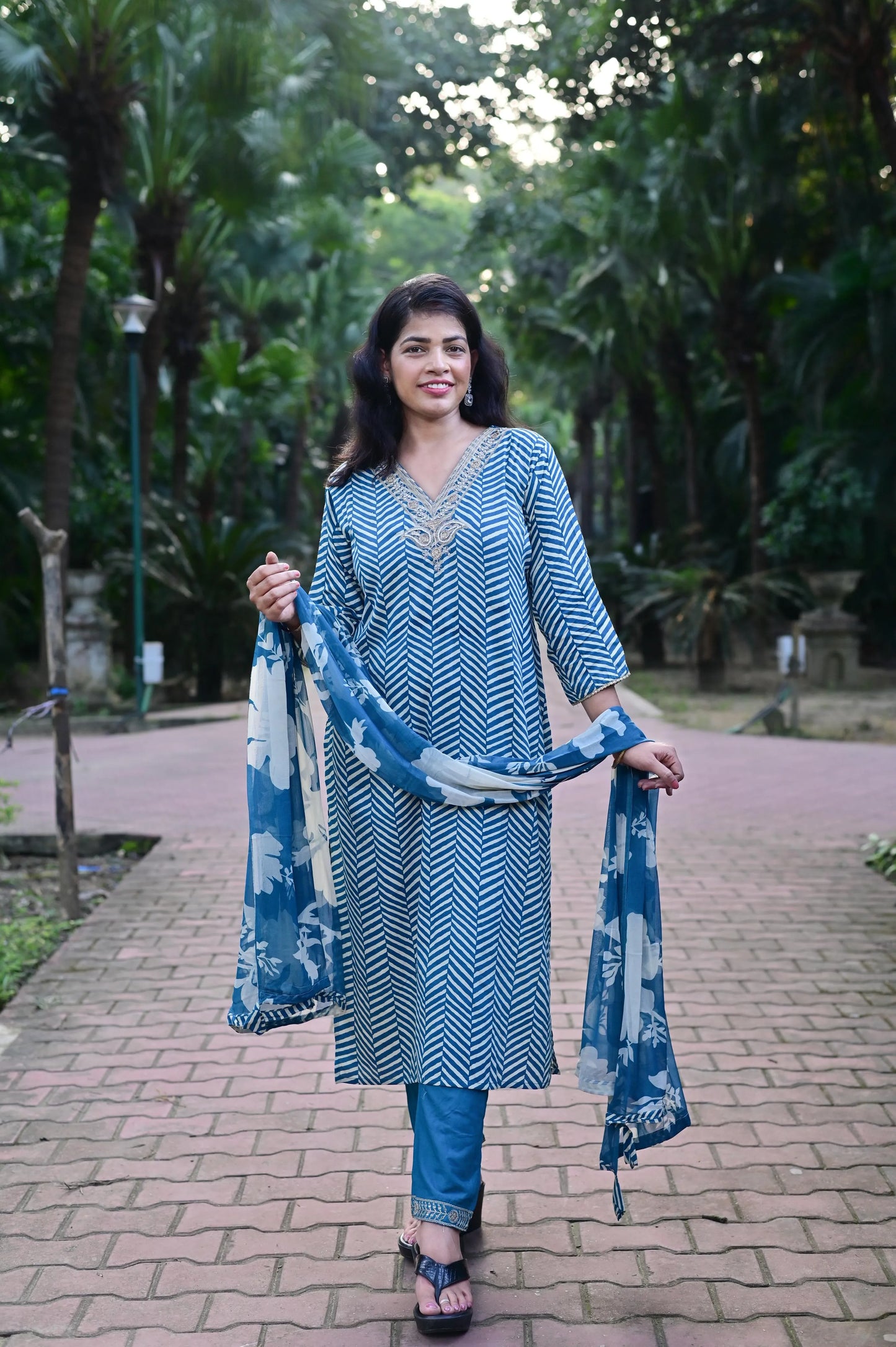 Women's blue chevron printed kurta pant set with floral dupatta